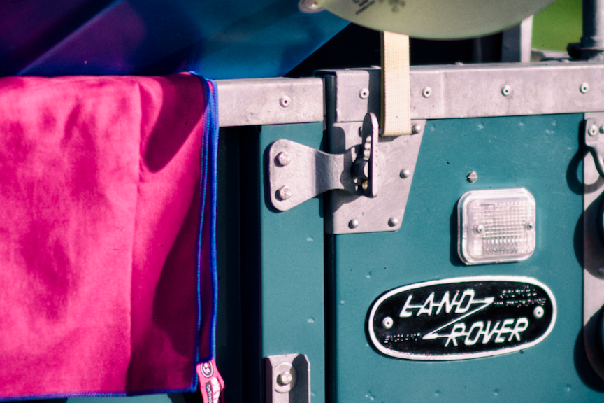 Surfing Portable Shower by OnTrackGear.  Outdoors transition with sand free towels, electric camp shower, camping tent floor.